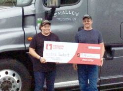 Eric Tackett and his wife with lottery check
