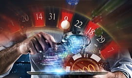 Logo med roulettehjul, casino-jetoner og andre elementer relateret til gambling.