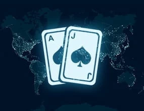 Blackjack cards on top of a world map