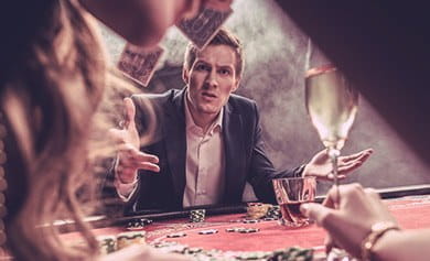 A gambler dismayed at his loss during a card game