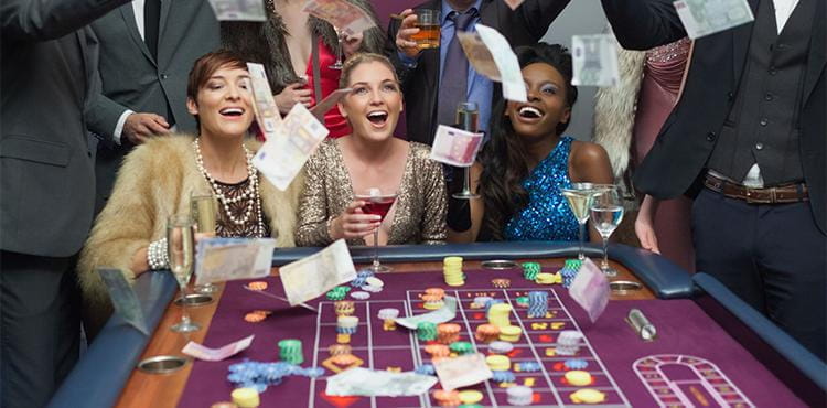 A group of successful roulette players celebrate winning a lot of money