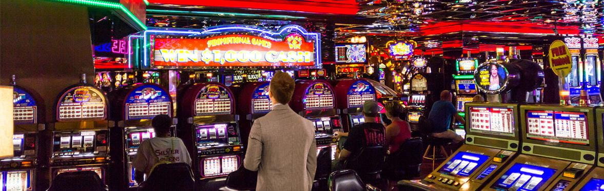A punter searching for the right slot machine