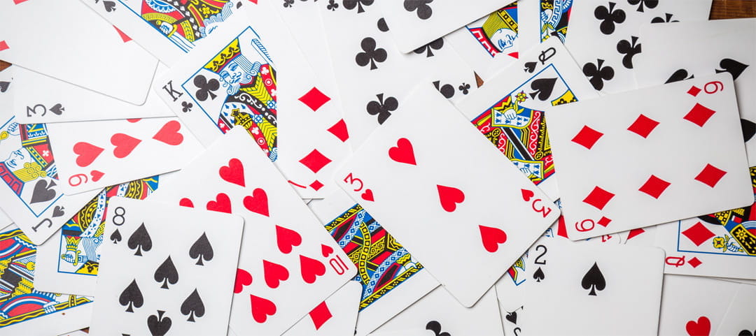 Playing Cards Spread on White Background