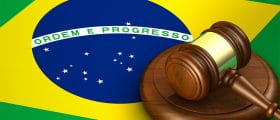 The Brazilian Flag as Background with a Gavel to the Front