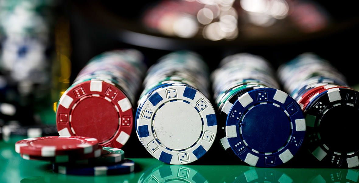 A Pale of Red Casino Chips on a Gambling Table 