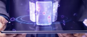 Hands Holding Tablet with Playing Cards