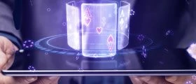 Hands Holding Tablet with Playing Cards