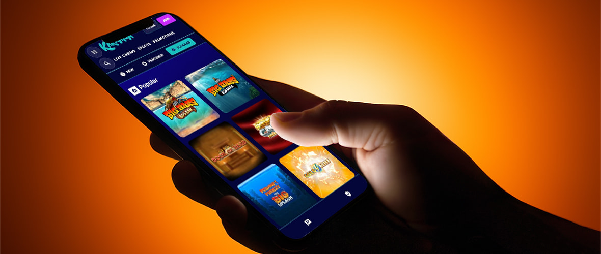 The Karamba Casino lobby viewed on iPhone — Note the bottom navigation bar and search bar placement.