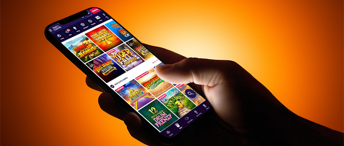 The PartyCasino lobby on mobile — note the top navigation tabs and search bar placement.
