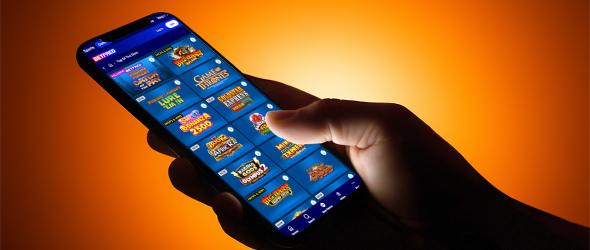 The Betfred casino lobby viewed on iPhone 15 — note the casino/sports/Vegas navigation tabs and the search bar placement.