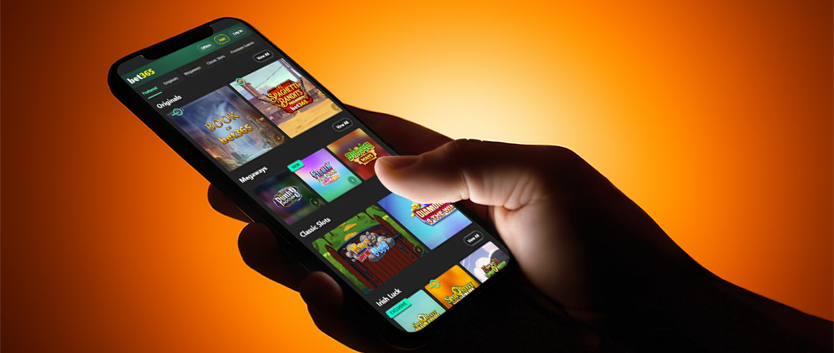 The bet365 casino lobby viewed on iPhone 14 Pro — note the sports/casino product switcher and the search bar placement.