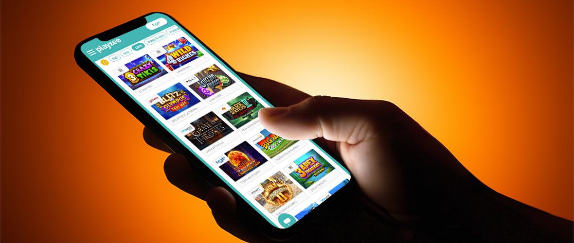 The Playzee Casino lobby viewed on iPhone 14 Pro — note the Professor Zee theme and the search bar placement.