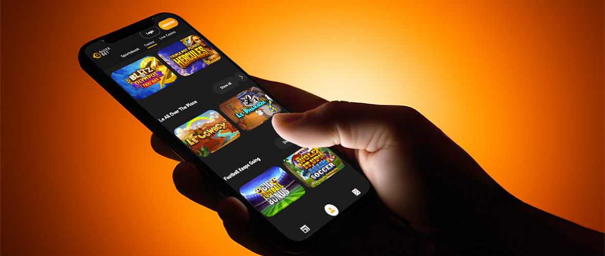 The QuickBet casino lobby viewed on iPhone 14 Pro — note the search bar placement and the provider filter.